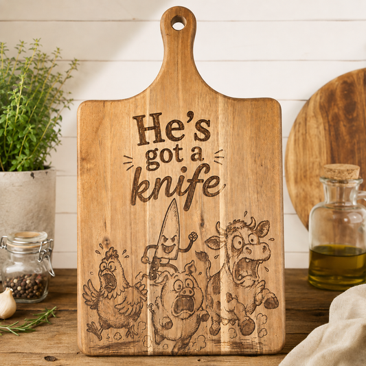 He's got a Knife Acacia Cutting Board - 15.9" x 8.9"